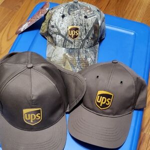 Three NEW UPS Caps Camo Brown Ear Warmers Flaps